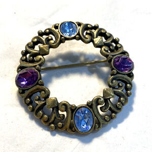 Vintage wreath brooch celtic motif ornate goldtone pin blue and purple stones